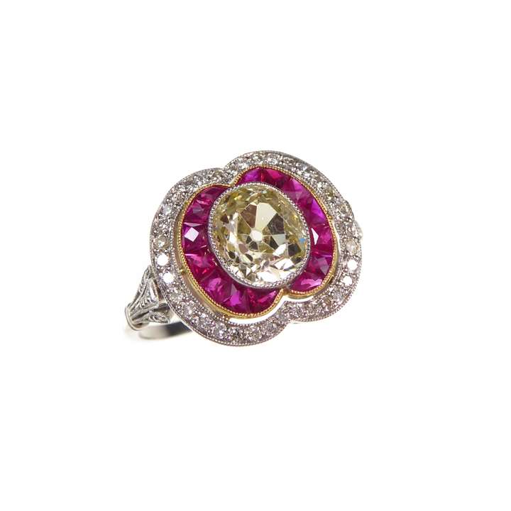 Diamond and ruby shaped oval cluster ring
